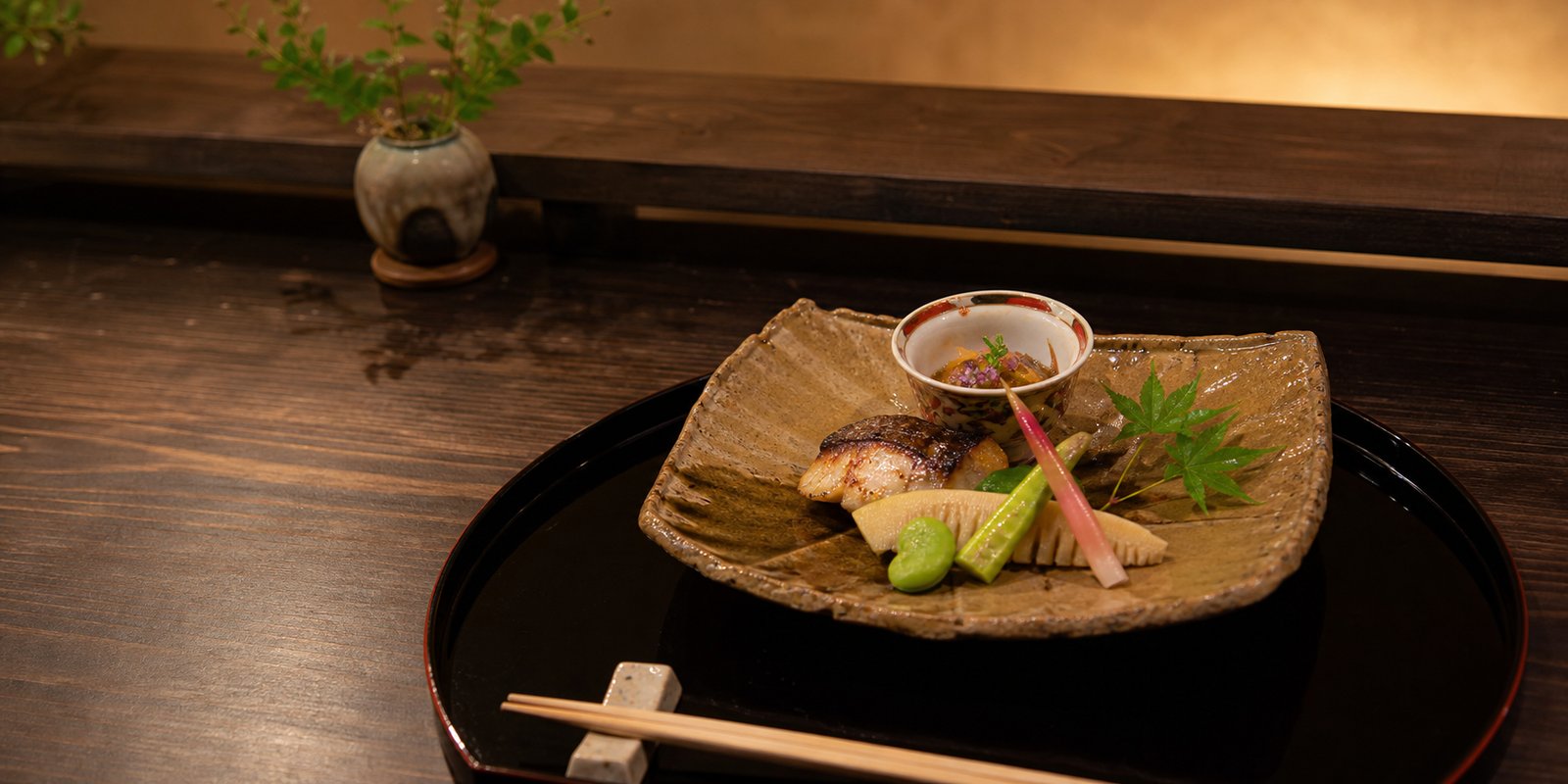 Seasonal Japanese course dish at a quiet counter